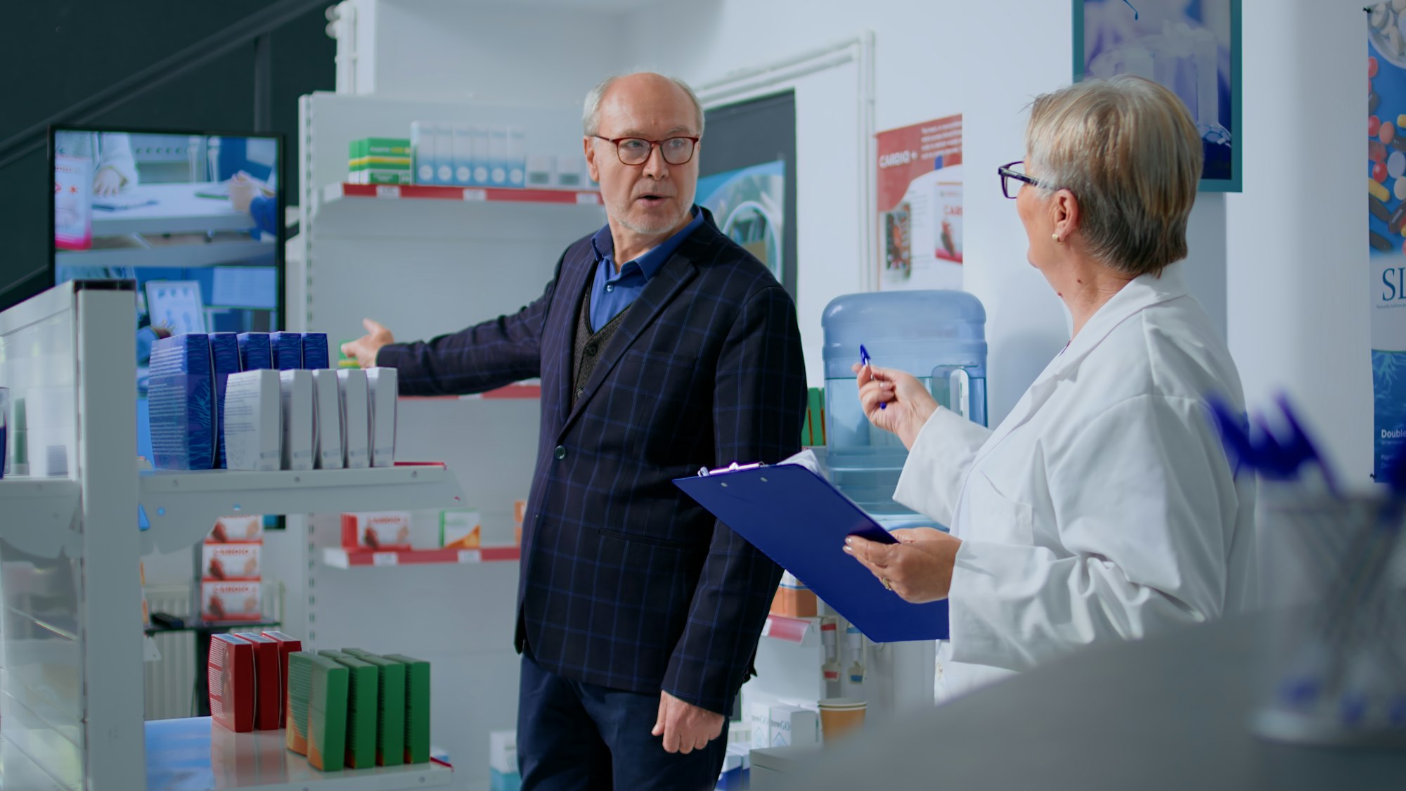 Man in drugstore interested in product