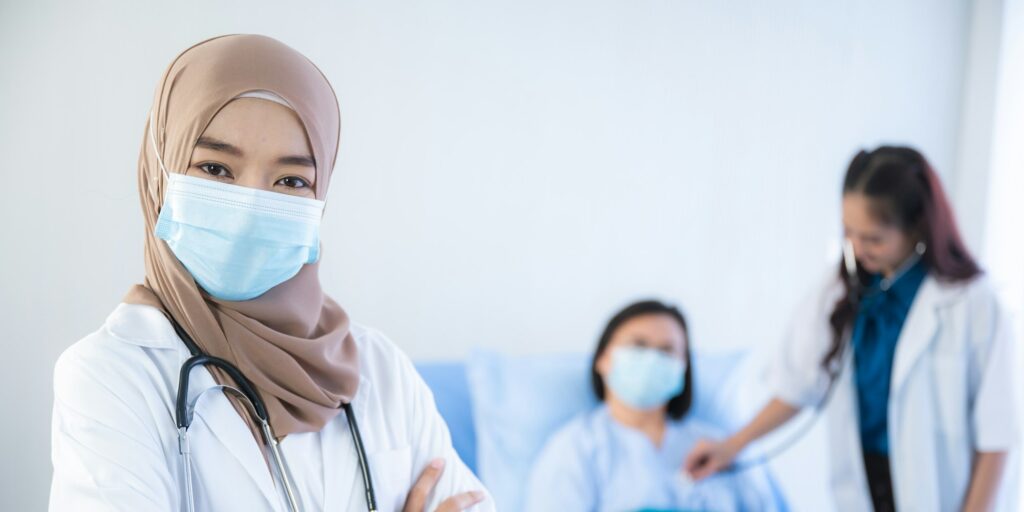 muslim asian woman doctor, Professional muslim doctor working in hospital, healthcare and medicine