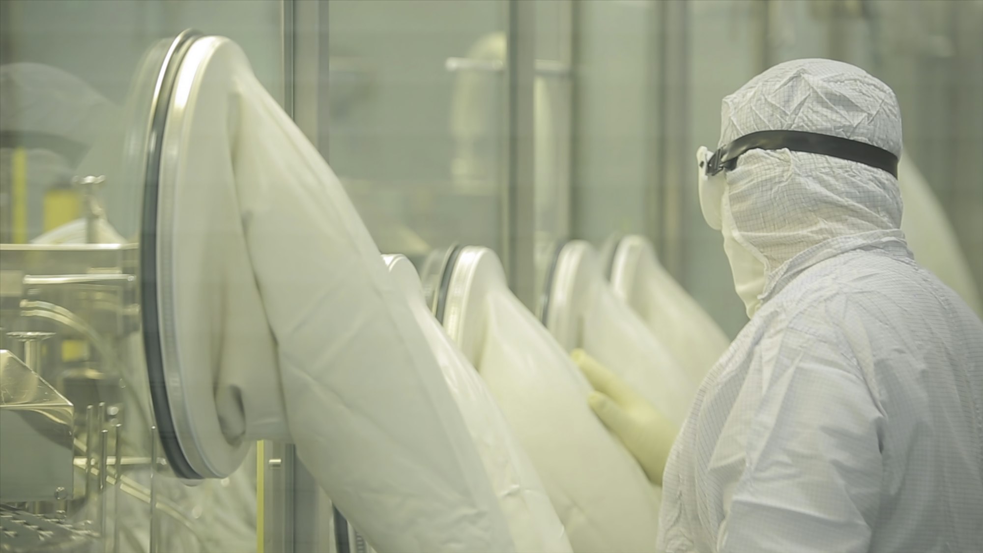 Pharmaceutical industry. Male factory worker inspecting quality of pills packaging in pharmaceutical