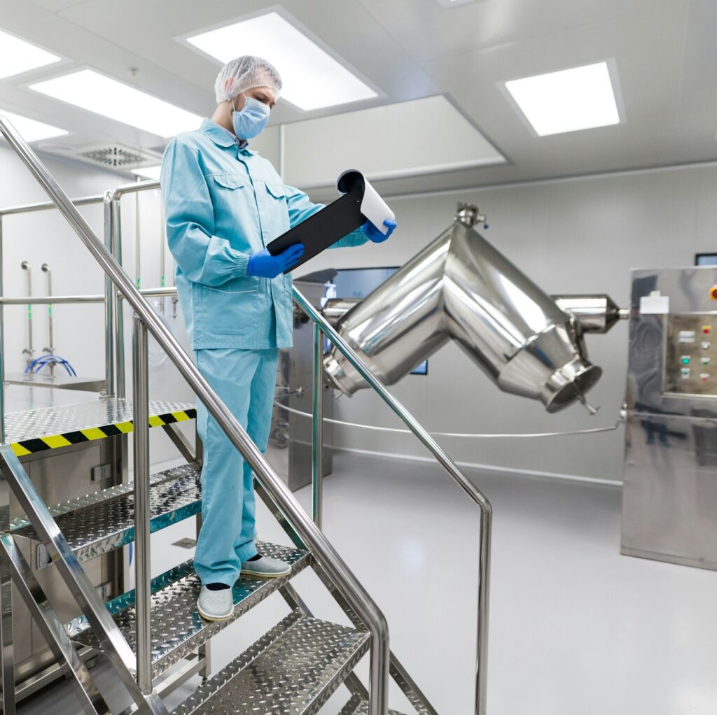 plant picture, scientist is standing on ladder in laboratory, checking readings