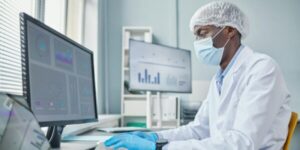 Chemist working on computer at office