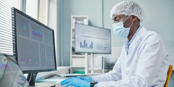Chemist working on computer at office