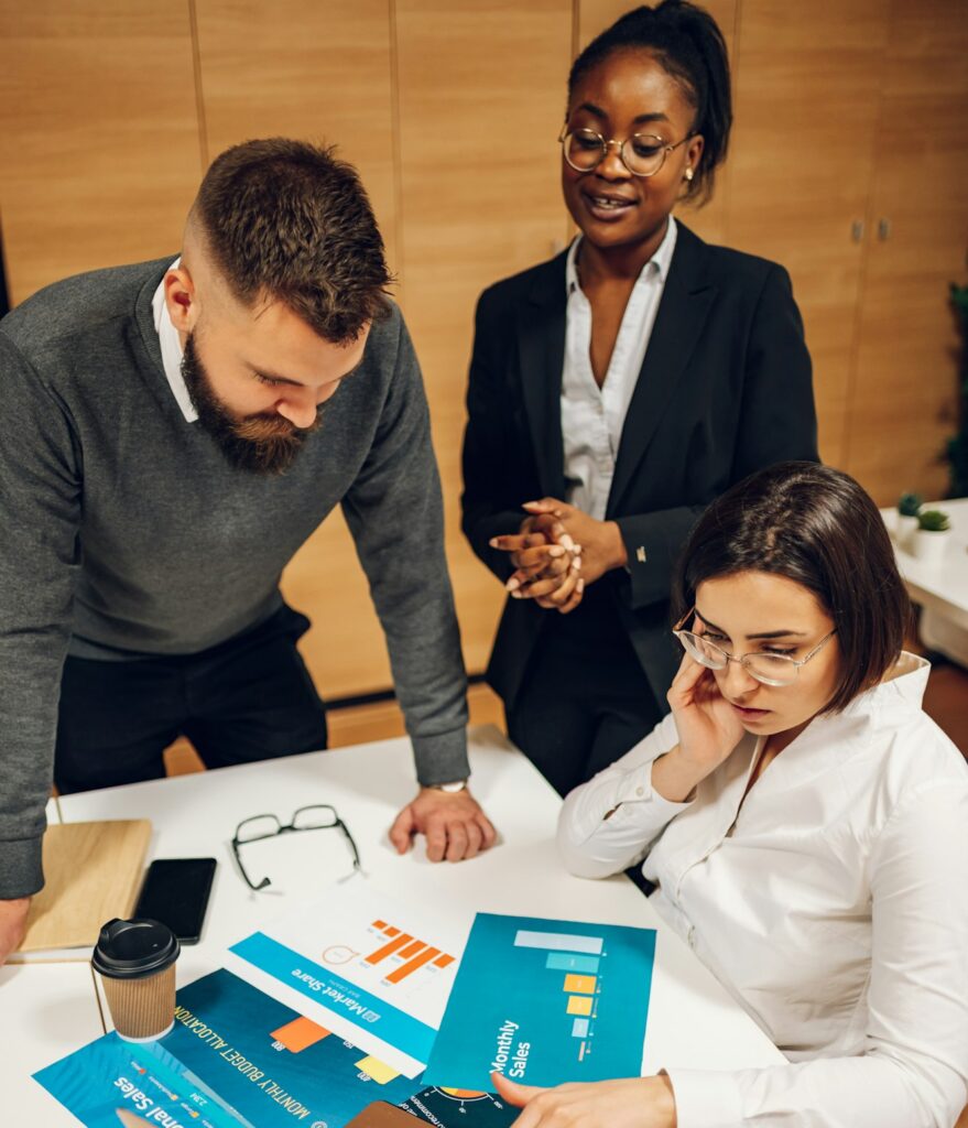 Business colleagues discussing chart document during a meeting