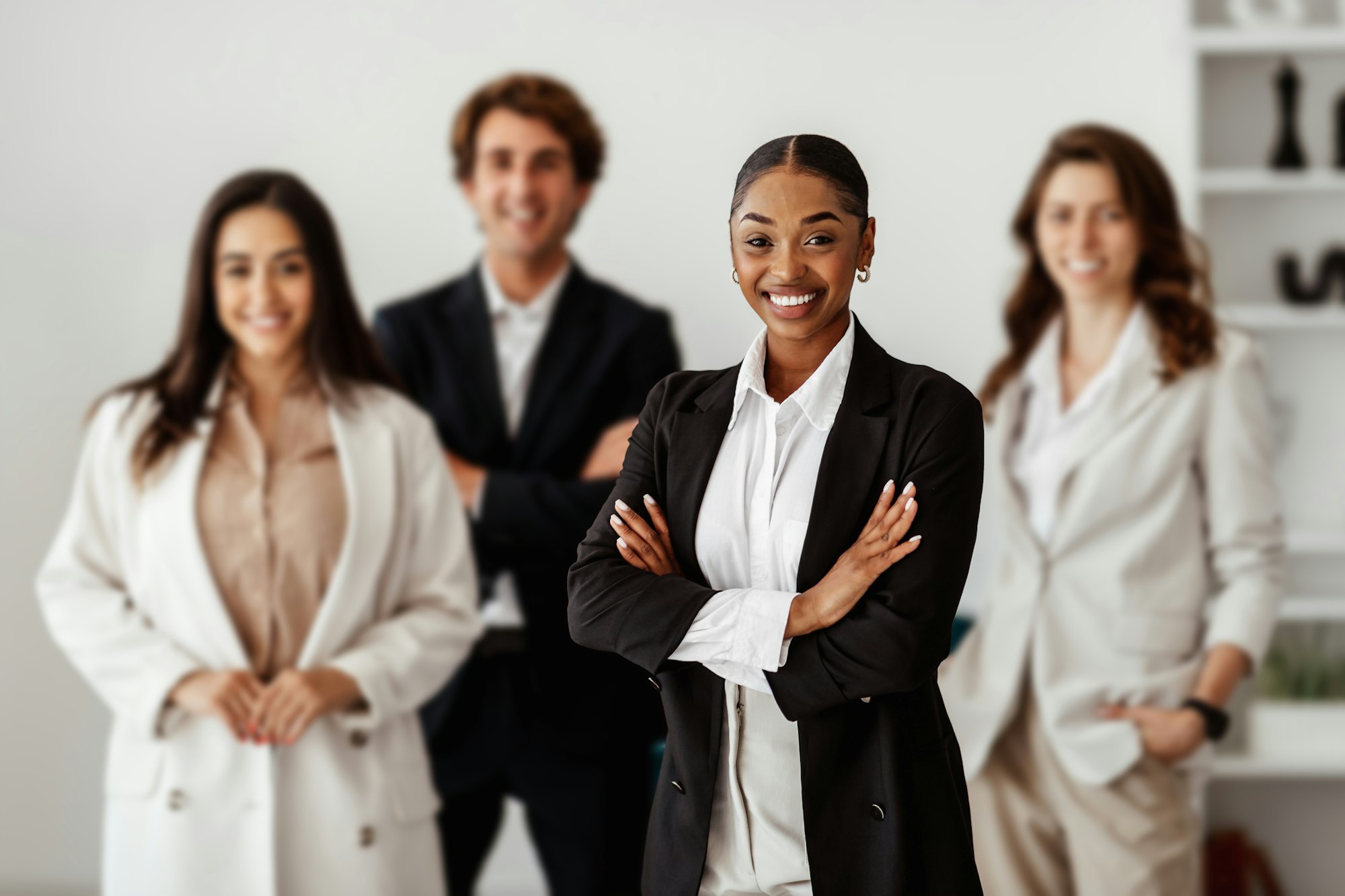 Diversity and business team portrait. Business people posing in office interior and smiling at