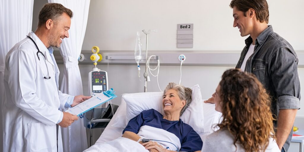 Doctor visiting senior patient with family