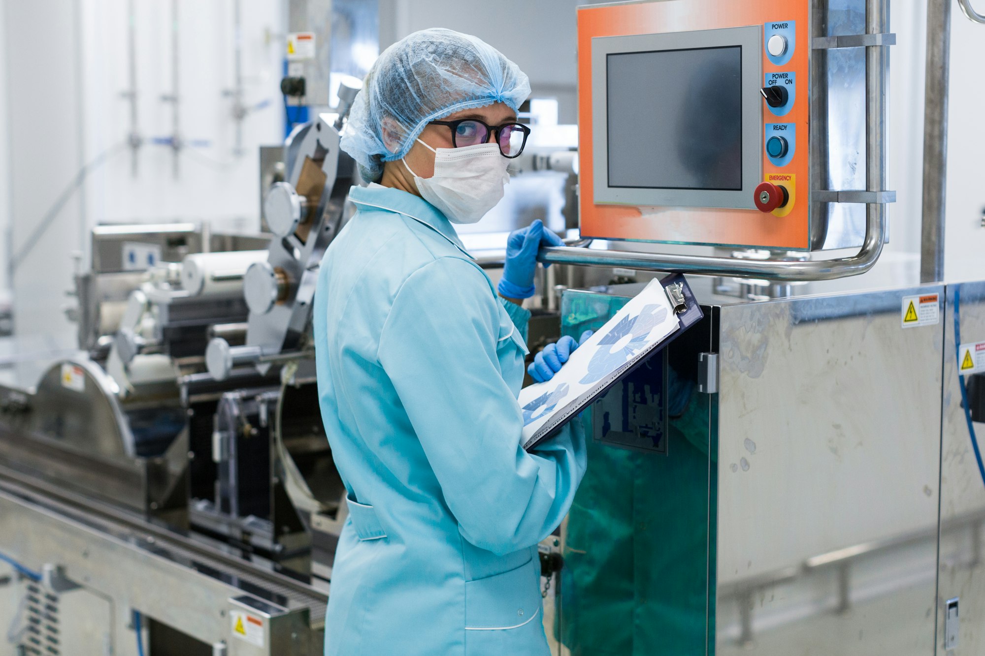 factory worker work with control panel