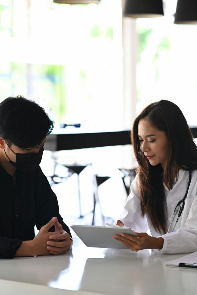 Female doctor explaining medical informations and diagnosis about the treatment.