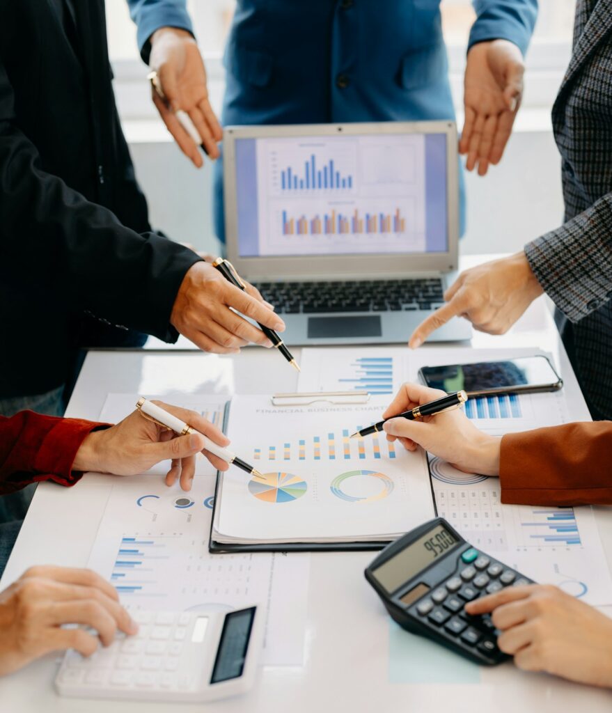 Business people making presentation with his colleagues and business smartphone, digital computer