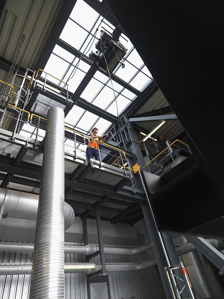 worker-operating-machinery-in-factory