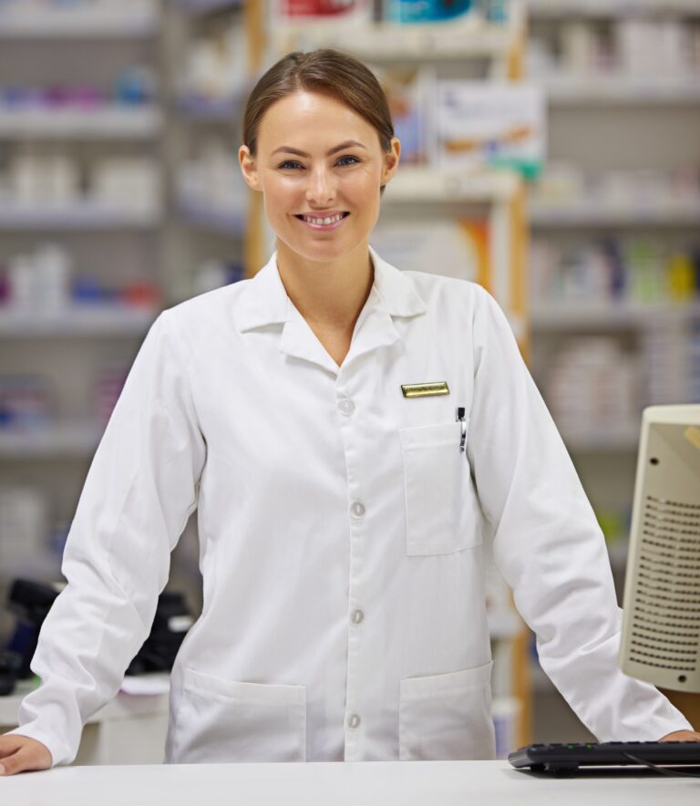 portrait-of-an-attractive-young-pharmacist-standing-at-the-prescription-counter-768x884