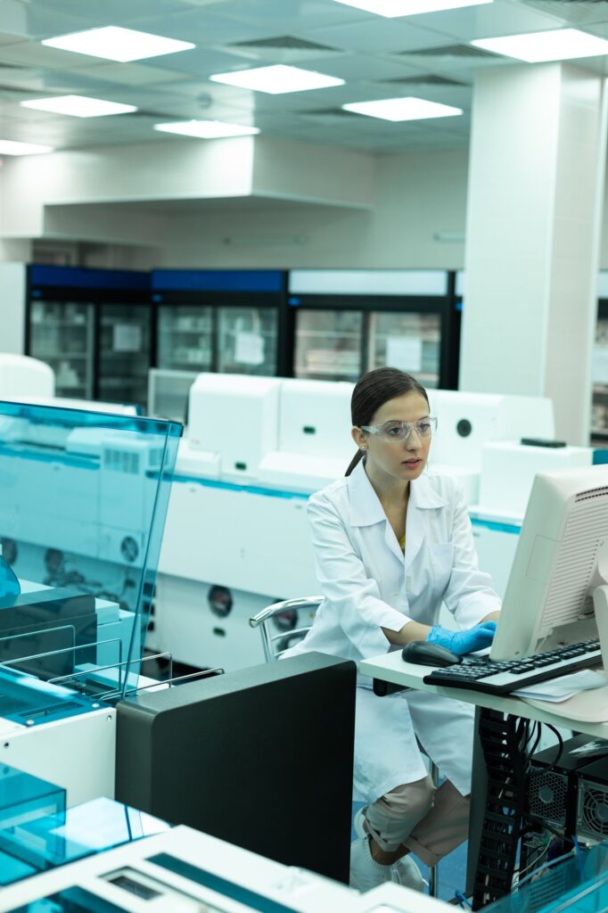 serious-young-researcher-testing-modern-equipment-in-lab-682x1024