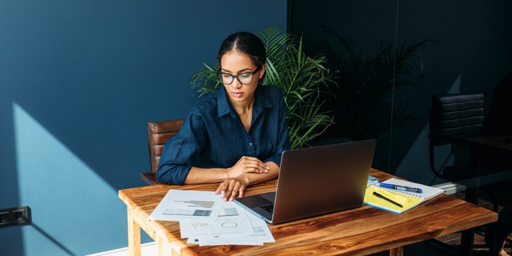 Young woman working with documents from home