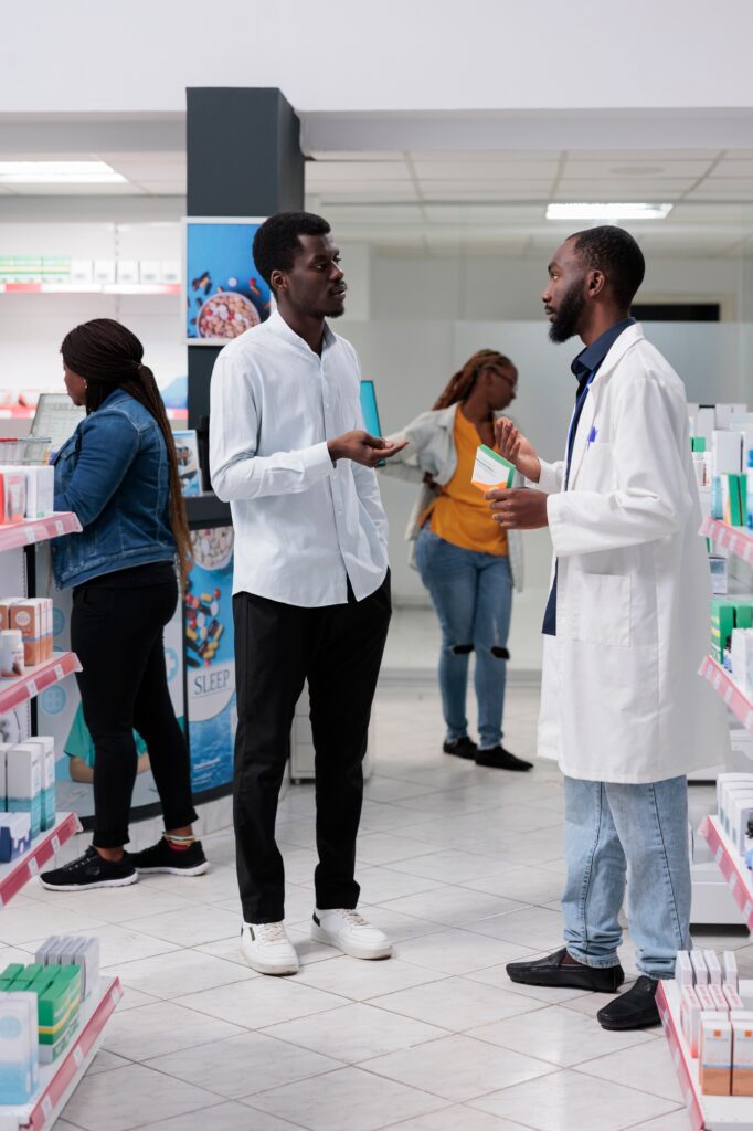 african-american-customers-purchasing-medicaments-in-pharmacy-store-682x1024