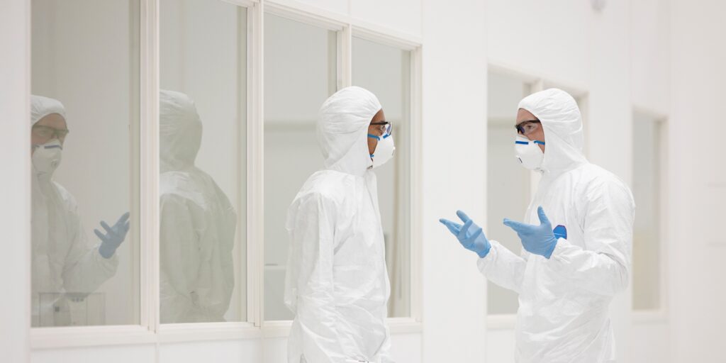 Scientists talking in laboratory